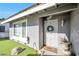 Gray house exterior with a white decorative door and a welcome mat at 7026 Westpark Ct, Las Vegas, NV 89147