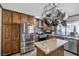 Kitchen with stainless steel appliances, granite countertops, and wood cabinets at 7026 Westpark Ct, Las Vegas, NV 89147