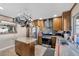 Kitchen with stainless steel appliances, granite island, and pot rack at 7026 Westpark Ct, Las Vegas, NV 89147