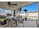 Covered patio with outdoor dining set and built-in grill at 7026 Westpark Ct, Las Vegas, NV 89147