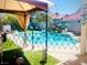 Inviting backyard pool with waterfall feature and safety fence at 7629 Delaware Bay Dr, Las Vegas, NV 89128