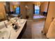 Elegant bathroom with dual sinks, a large shower, and a soaking tub at 7732 Tinted Mesa Ct, Las Vegas, NV 89149