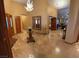 Spacious entry hall with high ceilings and travertine flooring at 7732 Tinted Mesa Ct, Las Vegas, NV 89149