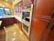 Double oven and microwave in modern kitchen at 7732 Tinted Mesa Ct, Las Vegas, NV 89149