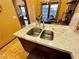 Modern kitchen sink and expansive granite countertop at 7732 Tinted Mesa Ct, Las Vegas, NV 89149