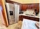 Stainless steel appliances and rich wood cabinets highlight this gourmet kitchen at 7732 Tinted Mesa Ct, Las Vegas, NV 89149