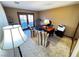 Home office with built-in desk, two chairs, and backyard access at 7732 Tinted Mesa Ct, Las Vegas, NV 89149