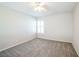 Spacious bedroom with ceiling fan and gray carpeting at 7809 Smokerise Ct, Las Vegas, NV 89131