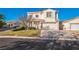 Two-story house with attached garage and landscaped front yard at 7809 Smokerise Ct, Las Vegas, NV 89131