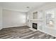 Living room with fireplace and gray vinyl plank flooring at 7809 Smokerise Ct, Las Vegas, NV 89131