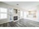 Open concept living and kitchen area with vinyl plank flooring at 7809 Smokerise Ct, Las Vegas, NV 89131