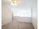 Spacious loft area with gray carpeting at 7809 Smokerise Ct, Las Vegas, NV 89131