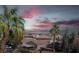 Community view with sunset, palm trees, and houses at 79 E Agate Ave # 306, Las Vegas, NV 89123