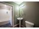 Updated bathroom with pedestal sink and toilet at 79 E Agate Ave # 306, Las Vegas, NV 89123