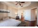 Bedroom with hardwood floors, ceiling fan, and ensuite bathroom at 79 E Agate Ave # 306, Las Vegas, NV 89123