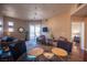 Glass dining table with four chairs in a bright condo dining area at 79 E Agate Ave # 306, Las Vegas, NV 89123