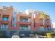 Condo building with parking and landscaping at 79 E Agate Ave # 306, Las Vegas, NV 89123