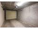 Spacious interior garage with overhead door at 79 E Agate Ave # 306, Las Vegas, NV 89123