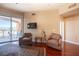 Comfortable living room with hardwood floors and balcony access at 79 E Agate Ave # 306, Las Vegas, NV 89123