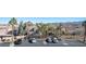 Parking lot with palm trees and mountain view at 79 E Agate Ave # 306, Las Vegas, NV 89123