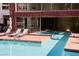 Inviting community pool with plenty of lounge chairs at 79 E Agate Ave # 306, Las Vegas, NV 89123