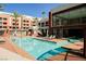 Resort-style pool with lounge chairs and building view at 79 E Agate Ave # 306, Las Vegas, NV 89123