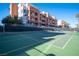 Well-maintained tennis court with building view at 79 E Agate Ave # 306, Las Vegas, NV 89123