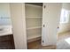 Bathroom storage featuring open shelving and a new bright-white cabinet at 801 Fort Churchill Rd, Pahrump, NV 89060