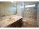 Bathroom with vanity, solid surface countertop, and a shower-over-tub with marble tile at 801 Fort Churchill Rd, Pahrump, NV 89060