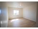 Well-lit bedroom with new light wood flooring and a bright window at 801 Fort Churchill Rd, Pahrump, NV 89060