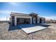 Well-designed home featuring an attached garage, a spacious driveway, and a modern aesthetic at 801 Fort Churchill Rd, Pahrump, NV 89060