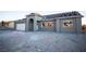 Newly constructed home with a gray exterior and a two-car garage at 801 Fort Churchill Rd, Pahrump, NV 89060