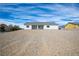 Exterior view of a single-story home with a desert landscape at 801 Fort Churchill Rd, Pahrump, NV 89060