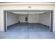 Two car garage featuring concrete floors, bright lighting and plenty of space for vehicles and storage at 801 Fort Churchill Rd, Pahrump, NV 89060