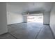 Spacious and clean two-car garage featuring a concrete floor, an automatic door, and ample room for storage at 801 Fort Churchill Rd, Pahrump, NV 89060