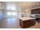 Open kitchen with a kitchen island, stainless steel appliances, and modern pendant lighting at 801 Fort Churchill Rd, Pahrump, NV 89060