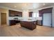 Modern kitchen featuring stainless steel appliances, dark wood cabinets, and a kitchen island at 801 Fort Churchill Rd, Pahrump, NV 89060