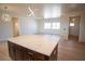 Stylish kitchen island with white countertops, dark wood cabinets, and modern pendant lighting at 801 Fort Churchill Rd, Pahrump, NV 89060