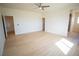 Spacious main bedroom boasts new light wood flooring and a modern ceiling fan at 801 Fort Churchill Rd, Pahrump, NV 89060