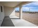 Covered patio with concrete flooring overlooking a desert landscape at 801 Fort Churchill Rd, Pahrump, NV 89060