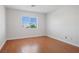 Well-lit bedroom with hardwood floors and window coverings at 81 Alpine Bay Ave, Las Vegas, NV 89148