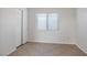 Simple bedroom with tile floor and double door closet at 81 Alpine Bay Ave, Las Vegas, NV 89148