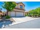 Two-story house with a three-car garage and side yard view at 81 Alpine Bay Ave, Las Vegas, NV 89148