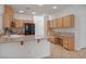 Spacious kitchen with wood cabinets, granite countertops and black appliances at 81 Alpine Bay Ave, Las Vegas, NV 89148