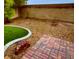 Landscaped backyard with brick patio and grass at 8384 Creek Canyon Ave, Las Vegas, NV 89113