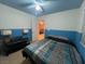 Bright bedroom with a double bed and blue walls at 8384 Creek Canyon Ave, Las Vegas, NV 89113