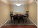 Dining room features hardwood floors, neutral walls, and a light fixture at 8384 Creek Canyon Ave, Las Vegas, NV 89113