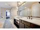 Bathroom with double vanity and glass block wall at 8593 Garden Valley Ct, Las Vegas, NV 89178