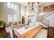 Elegant dining room with a rustic wooden table and chandelier at 8593 Garden Valley Ct, Las Vegas, NV 89178