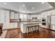 Modern kitchen with white cabinets, granite countertops, and stainless steel appliances at 8593 Garden Valley Ct, Las Vegas, NV 89178